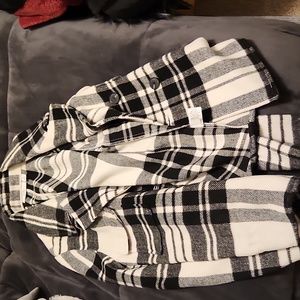 Woman's black and white plaid coat